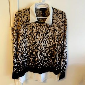 Like new. Thin sweater material. All one piece.